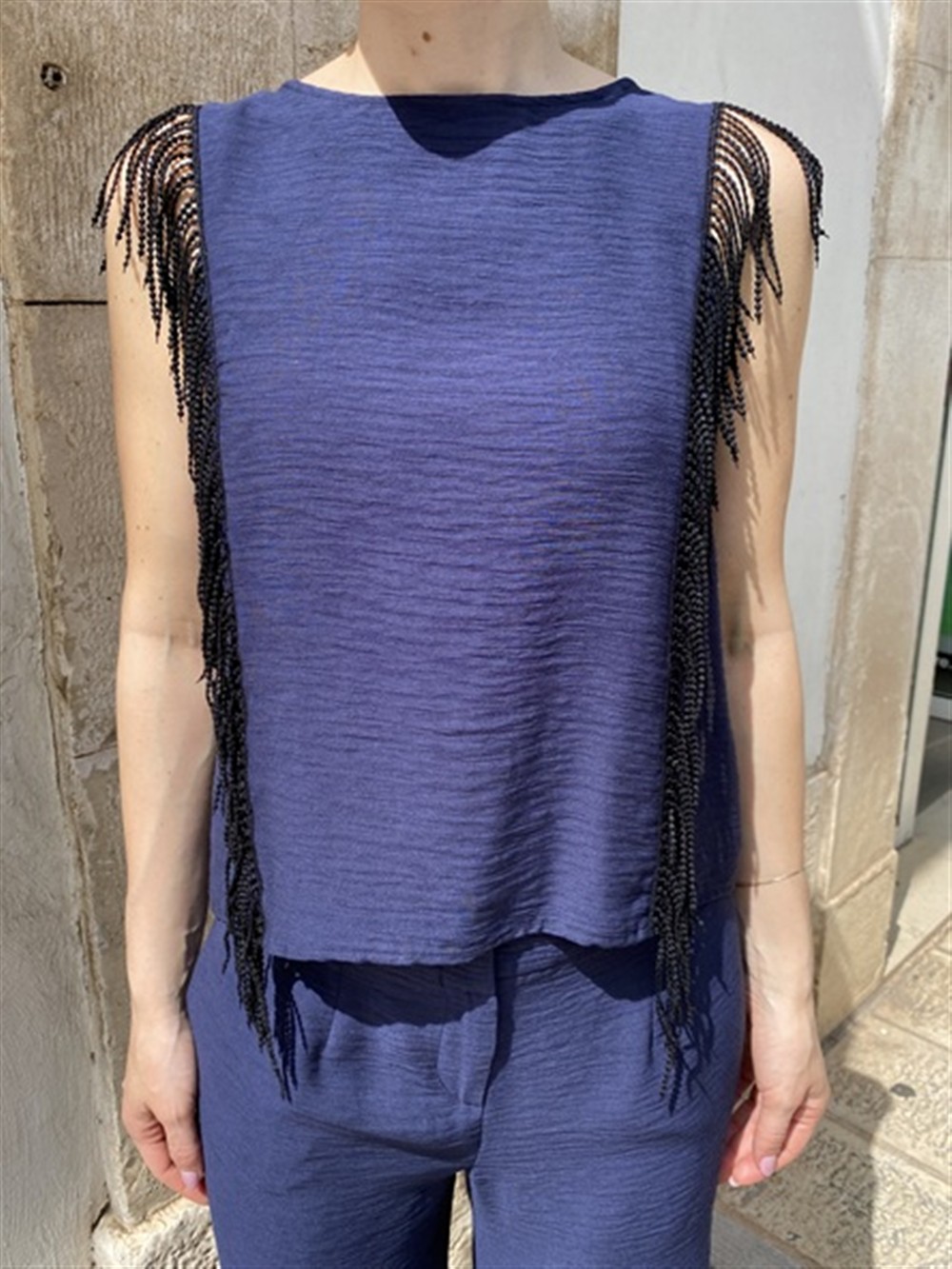 <p>
  Top con frange
</p>Tolérance