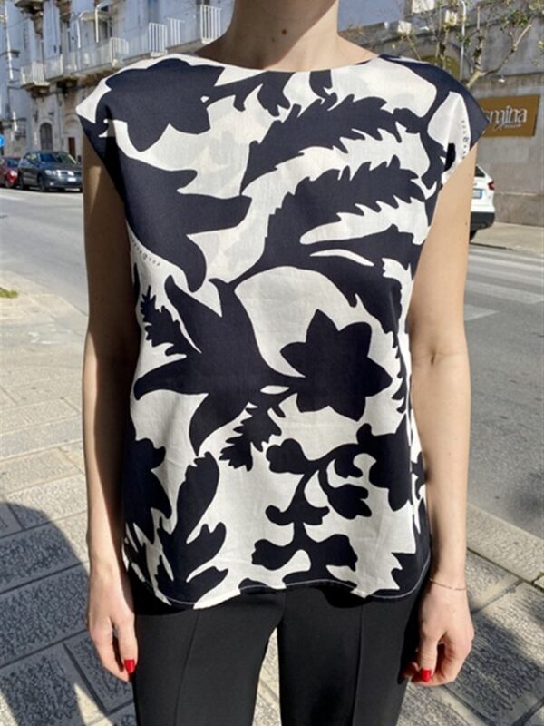 <p>
  Top a fantasia indossabile da entrambi i lati
</p>Tolérance Couture